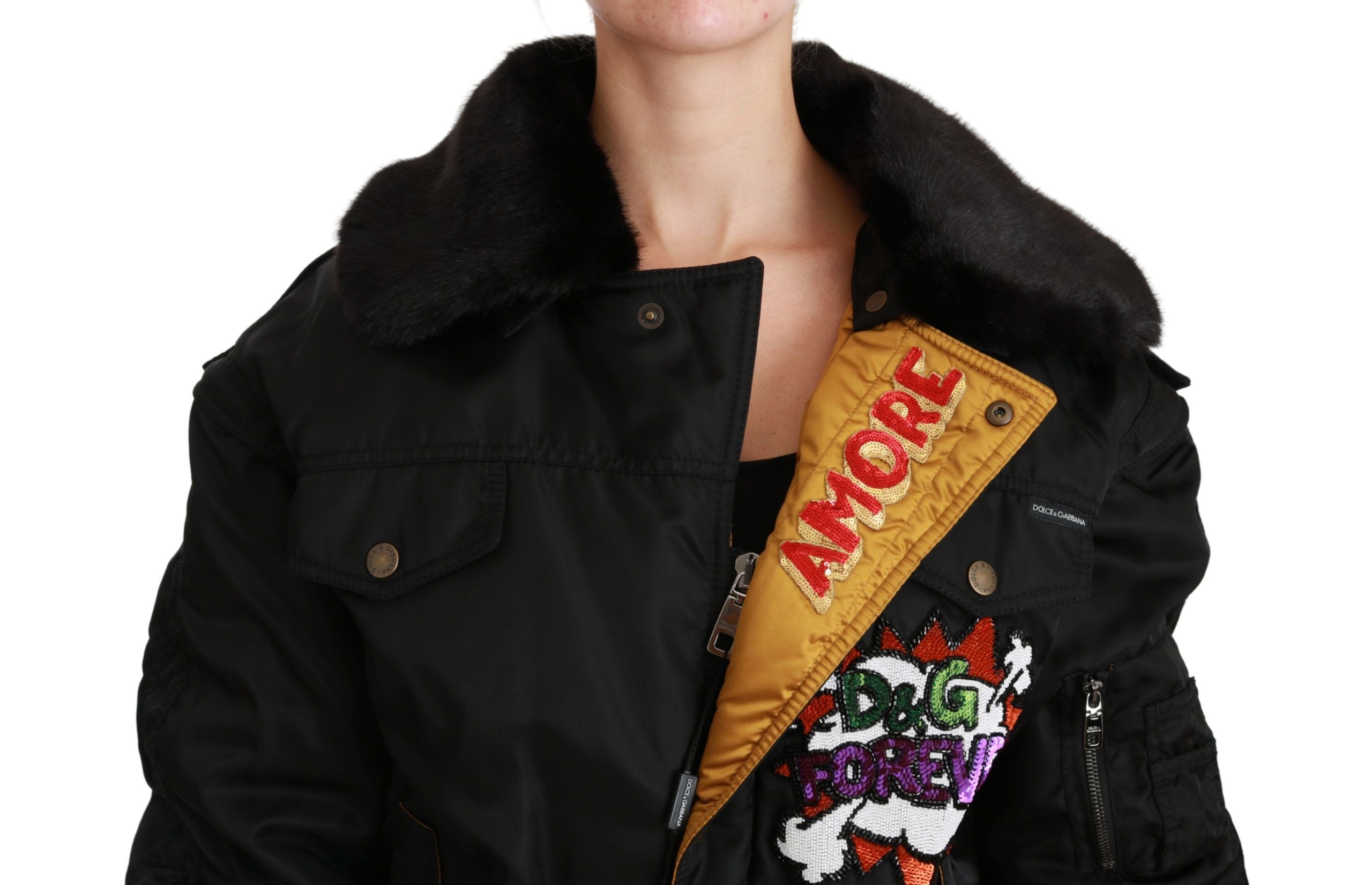 Black sequined bomber jacket with queen crown design by Dolce & Gabbana, featuring a stylish and bold fashion statement.