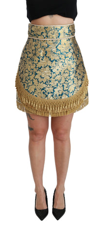 Blue high waist jacquard skirt with gold tassels, designed by Dolce & Gabbana, featuring intricate fabric pattern and elegant style.