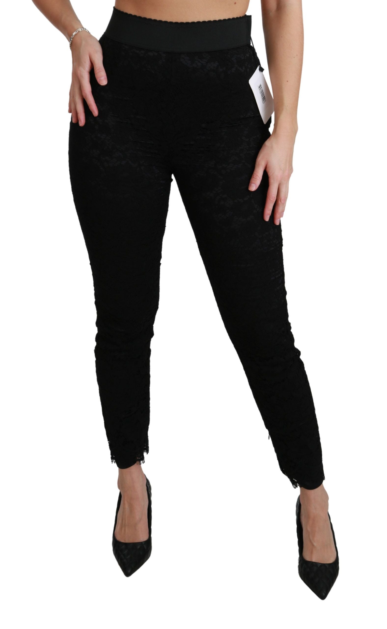 Black lace skinny high-waist cotton pants by Dolce & Gabbana, shown with a close-up of the fitted waistband and lace details.