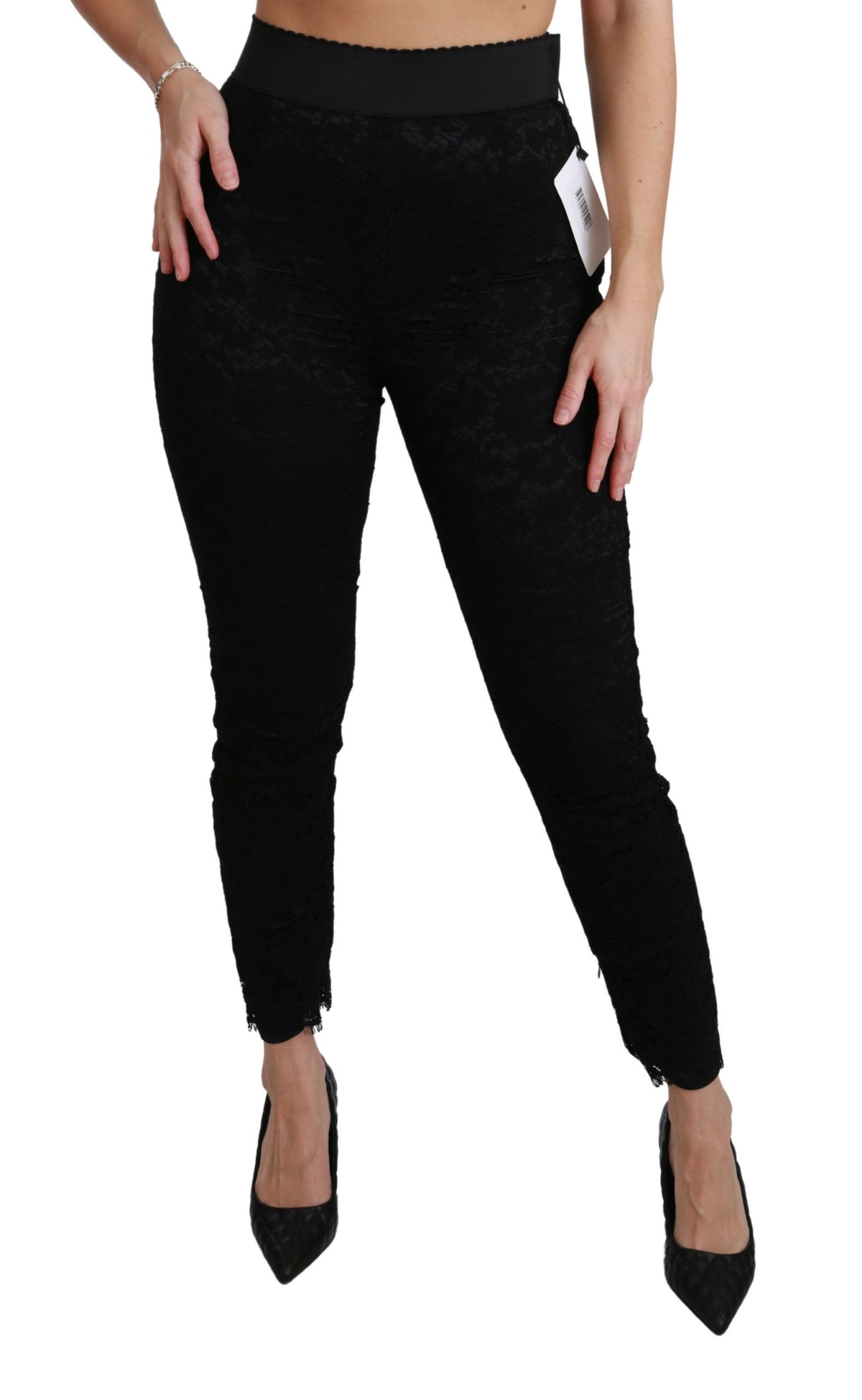 Black lace skinny high-waist cotton pants by Dolce & Gabbana, shown with a close-up of the fitted waistband and lace details.