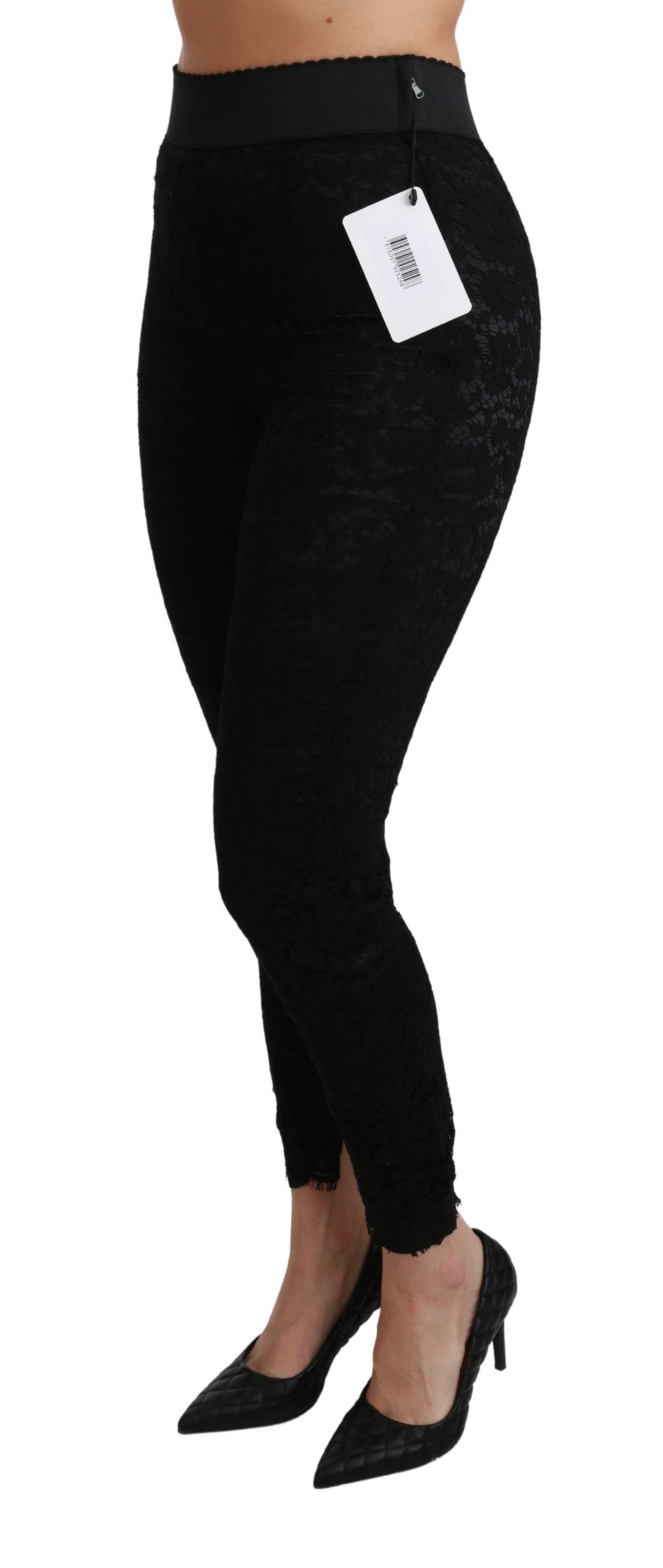 Black lace skinny high waist cotton pants by Dolce & Gabbana, showcasing their fitted silhouette and intricate lace detailing.