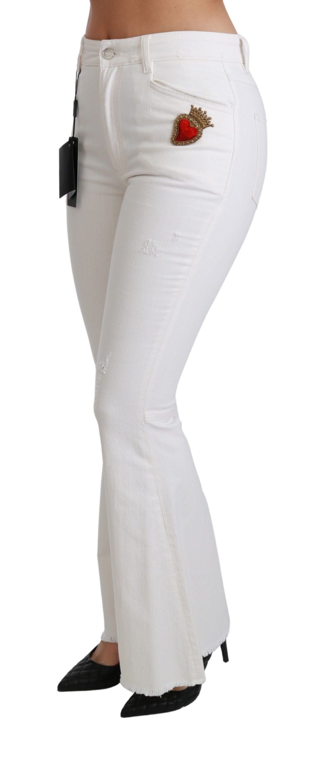 White heart-flared stretch cotton pants by Dolce & Gabbana, showing the fitted waist and flared leg design.