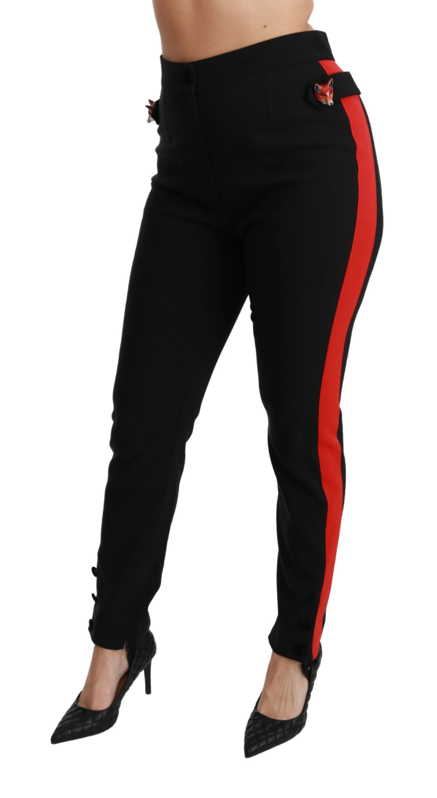 Black skinny stretch cotton pants with fox head design by Dolce & Gabbana, close-up of fitted style and high-quality fabric.