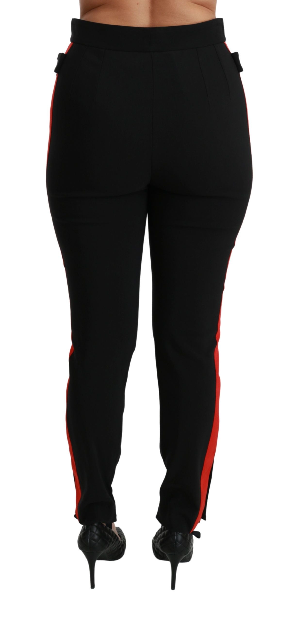 Black skinny stretch cotton pants with fox head print by Dolce & Gabbana, showing a close-up of the fitted design and waistband.