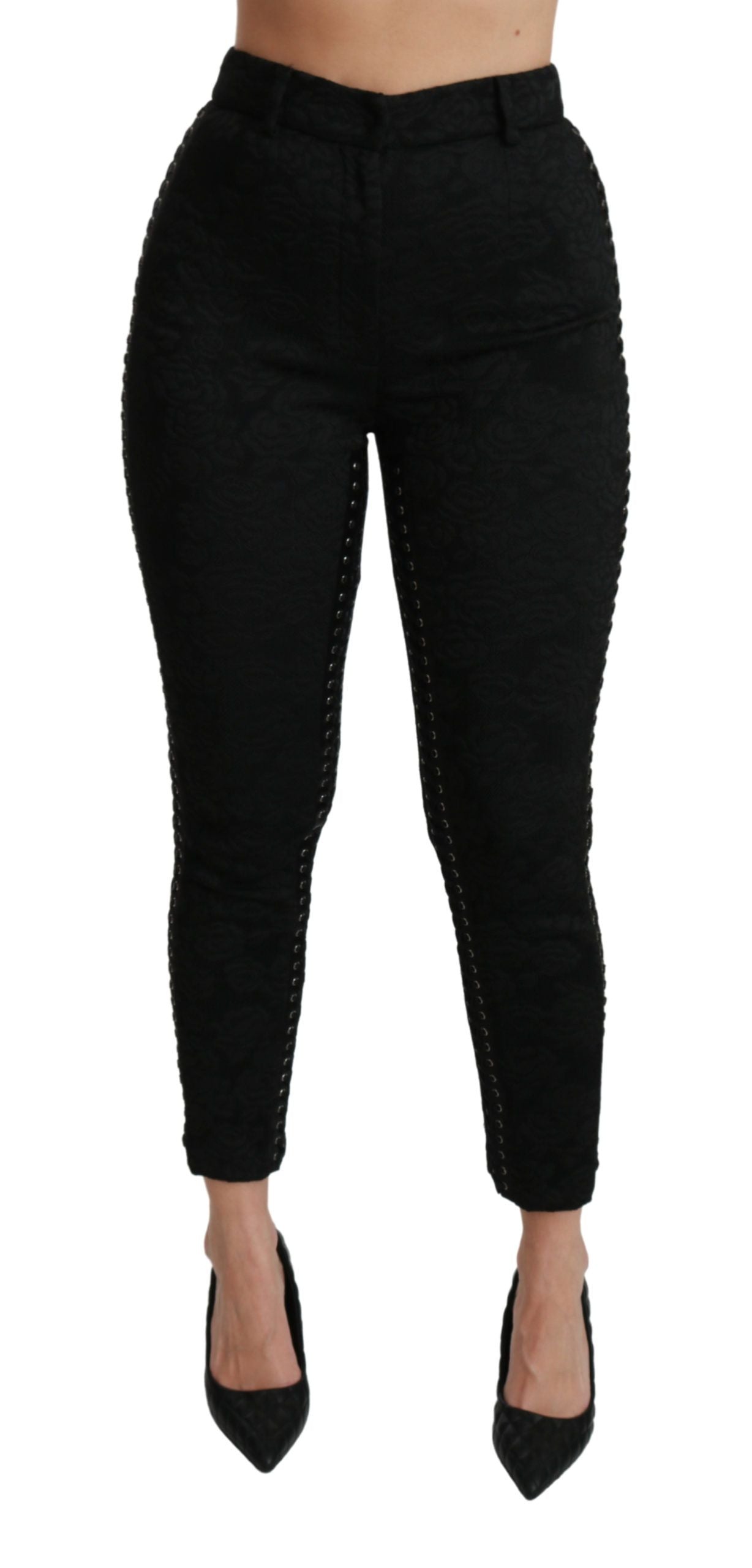 Black brocade skinny high-waist pants by Dolce & Gabbana, showing detailed textured fabric and sleek fit.