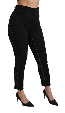 Black brocade skinny high-waist pants by Dolce & Gabbana, showcasing intricate fabric details and sleek fit.