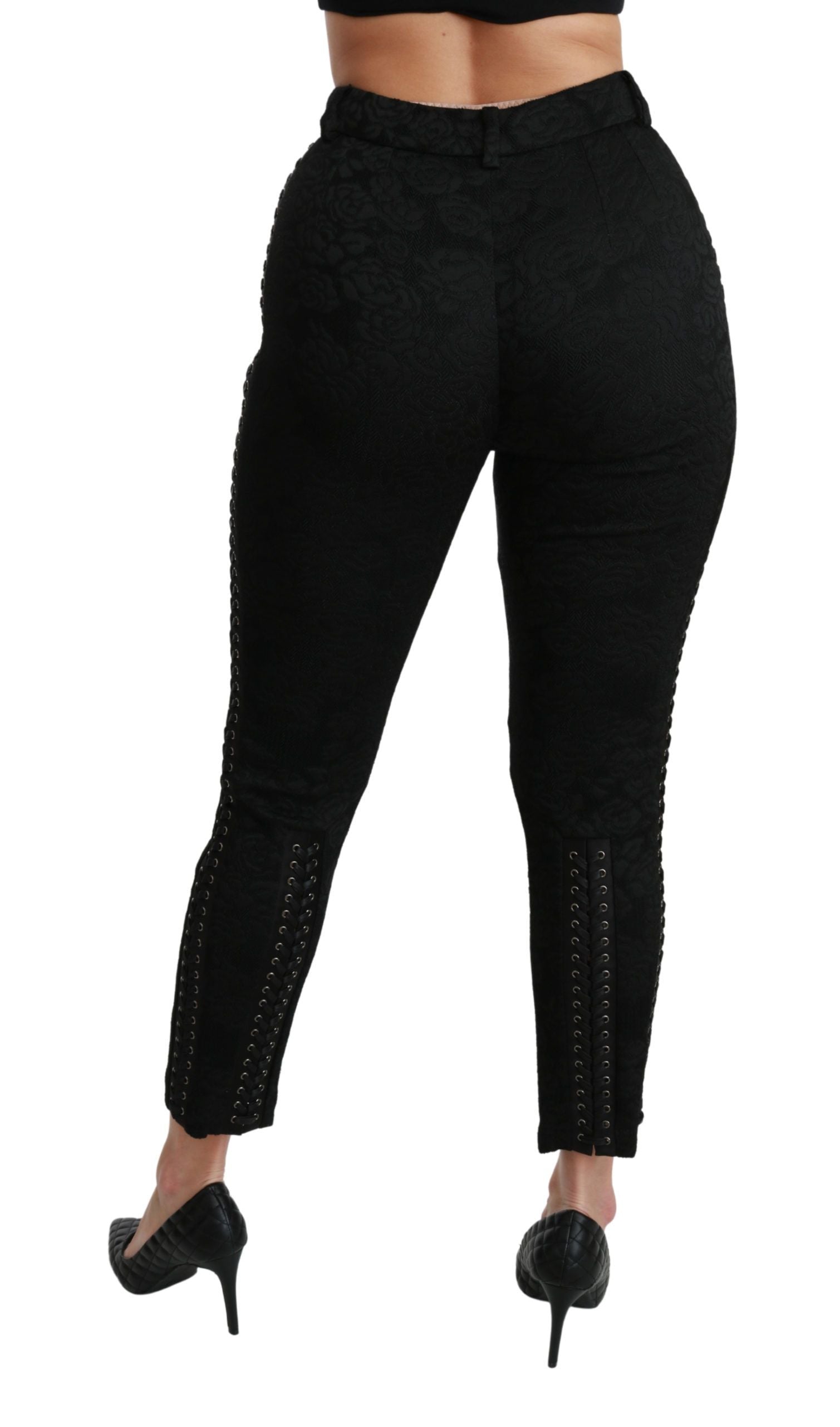 Black brocade skinny high-waist pants by Dolce & Gabbana, featuring intricate pattern and tailored fit, shown on a model.