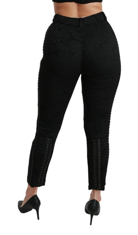 Black brocade skinny high-waist pants by Dolce & Gabbana, featuring intricate pattern and tailored fit, shown on a model.