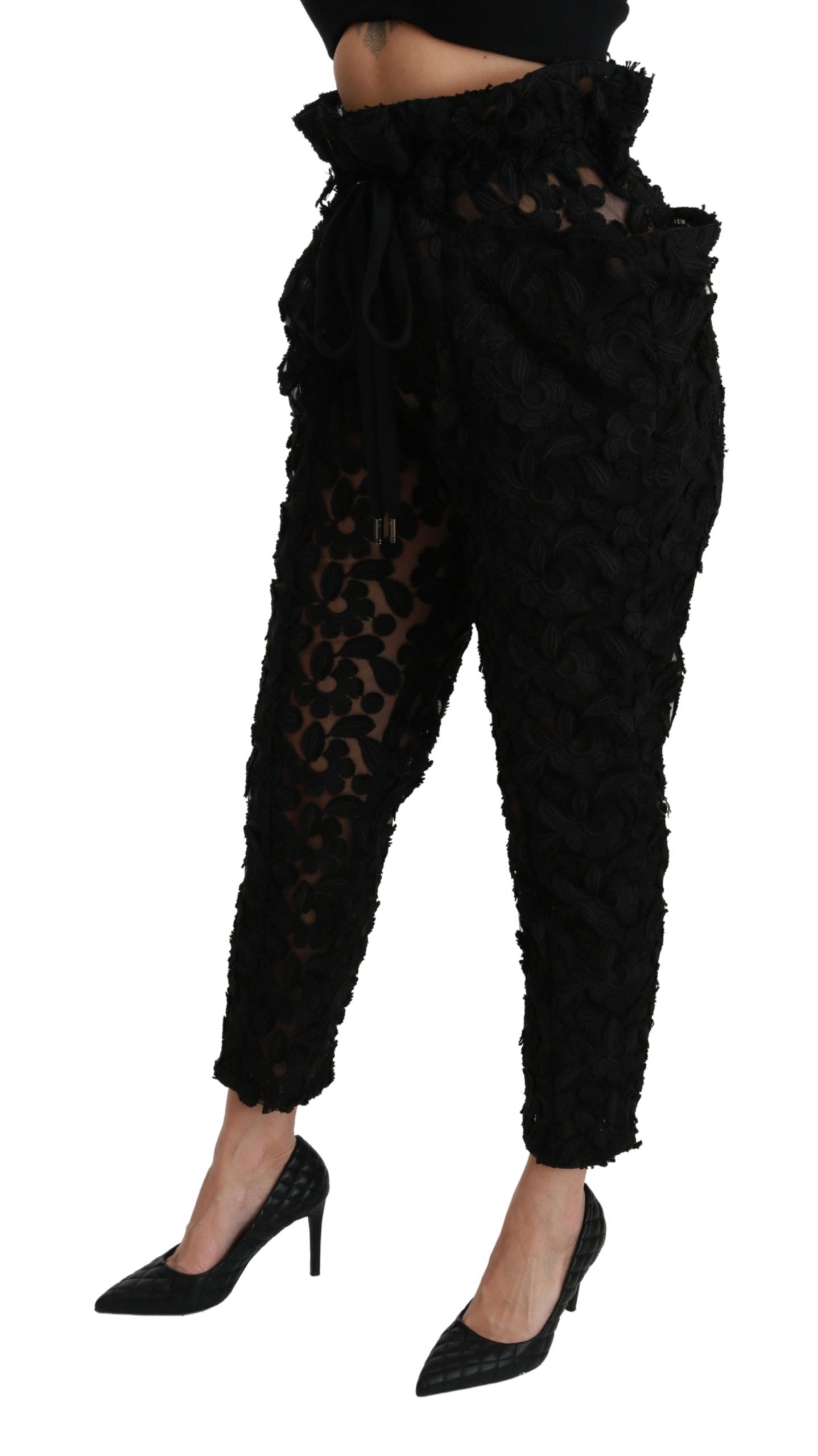 Black floral lace tapered high waist pants by Dolce & Gabbana, featuring intricate lace details and a fitted high-rise silhouette.
