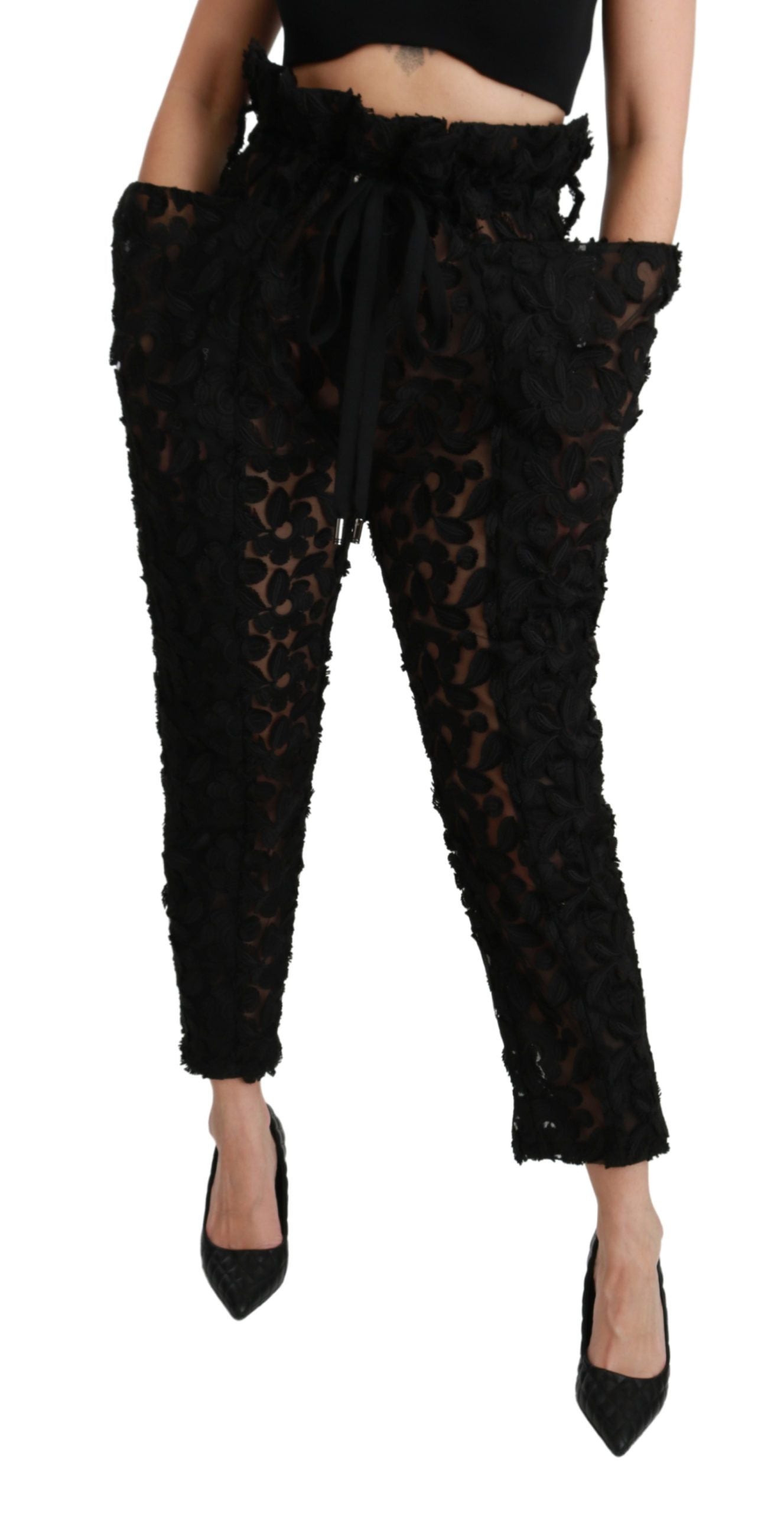 Black floral lace tapered high waist pants by Dolce & Gabbana with intricate lace detailing and a sleek high-rise fit.