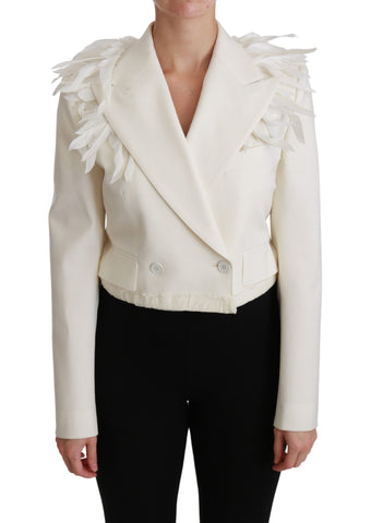 White double-breasted wool coat jacket by Dolce & Gabbana, shown on a hanger with detailed collar and button design.