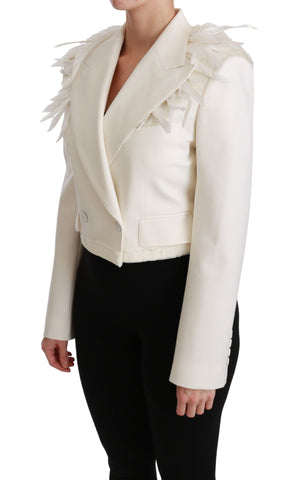 White double-breasted wool coat jacket from Dolce & Gabbana, shown hanging on a wooden hanger with a tailored fit.