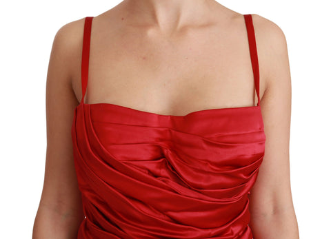 Red silk stretch mermaid bodycon dress by Dolce & Gabbana displayed on a hanger.