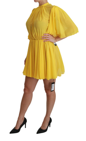 Yellow silk A-line mini dress with pleated skirt by Dolce & Gabbana, showcasing a stylish and elegant design.