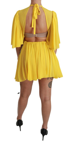 Yellow pleated A-line mini silk dress by Dolce & Gabbana, showcasing its elegant pleats and smooth fabric.