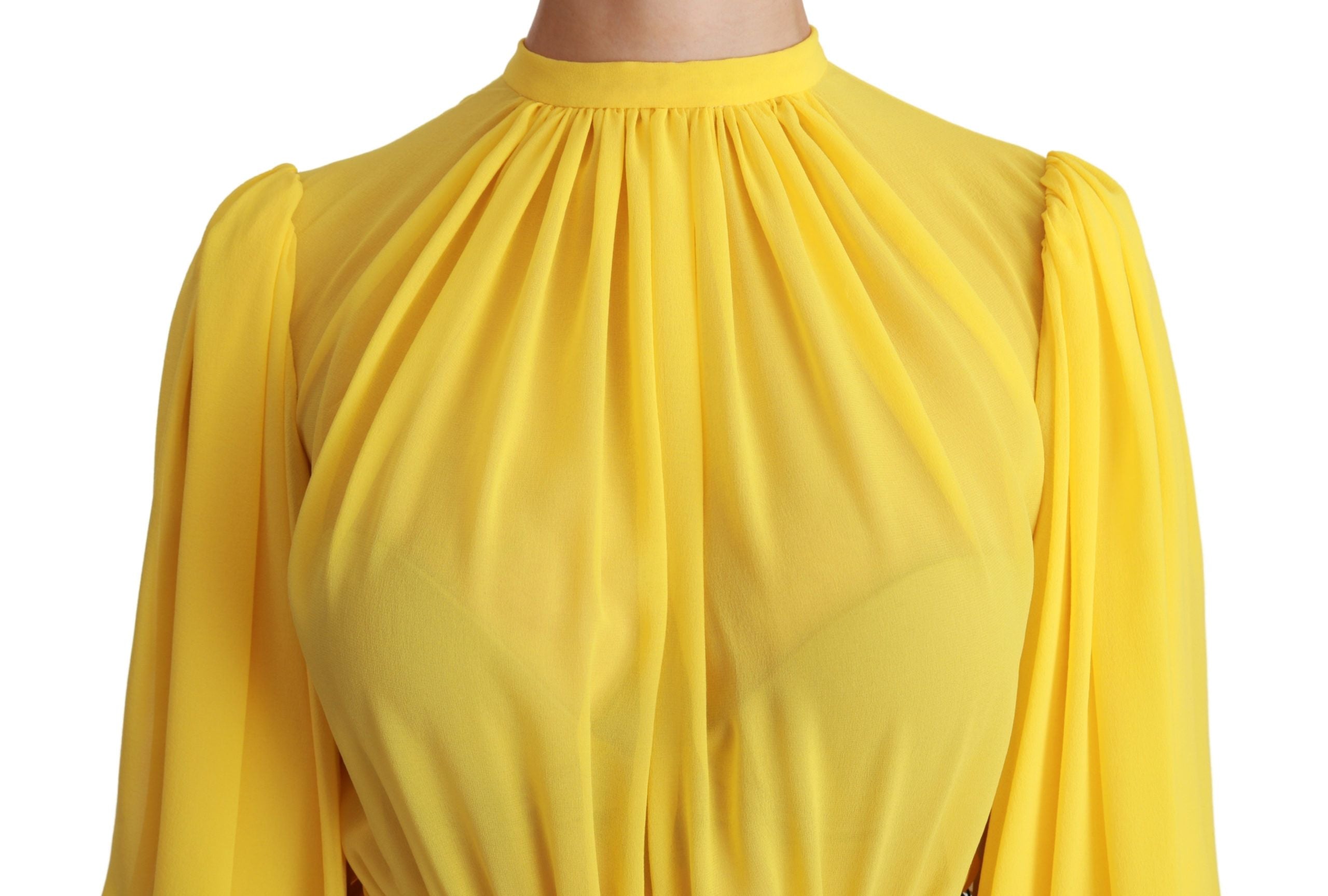 Yellow pleated A-line mini dress made of 100% silk by Dolce & Gabbana, featuring a stylish and elegant design.
