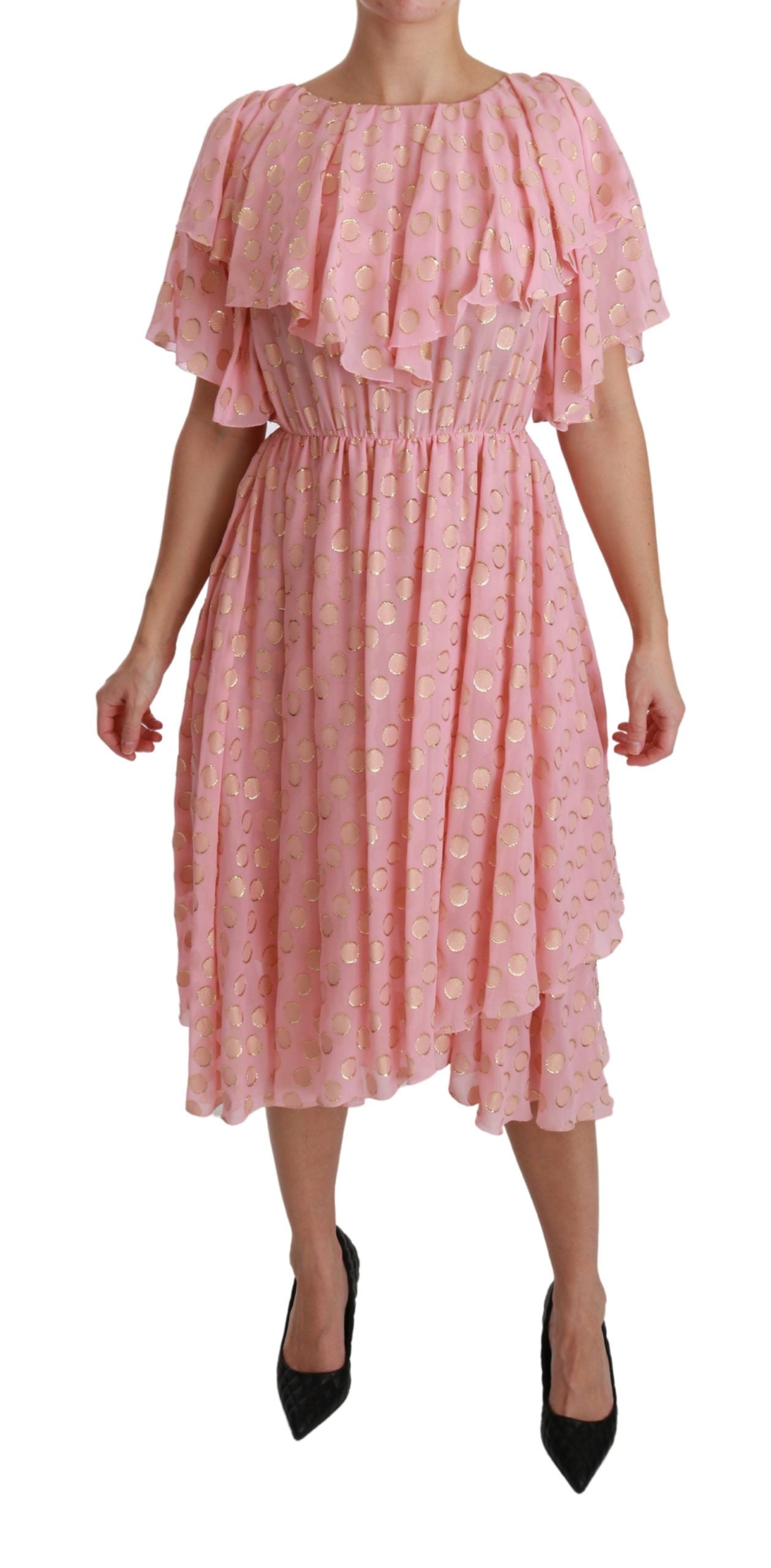 Pink silk polka dot pleated A-line midi dress by Dolce & Gabbana on a model displaying the elegant design.
