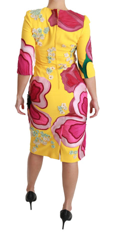 Yellow floral crystal bodycon sheath dress by Dolce & Gabbana, form-fitting with floral patterns and crystal embellishments.