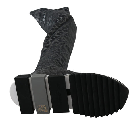 Gray leopard print high top sneakers by Dolce & Gabbana, showcasing stylish sneakers with a bold animal pattern and lace-up design.
