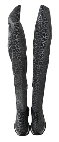 Gray leopard high top sneakers by Dolce & Gabbana with lace-up design and stylish bootie style, featuring bold leopard print.