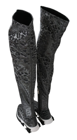 Gray leopard high top sneakers by Dolce & Gabbana with stylish bootie design and lace-up front.