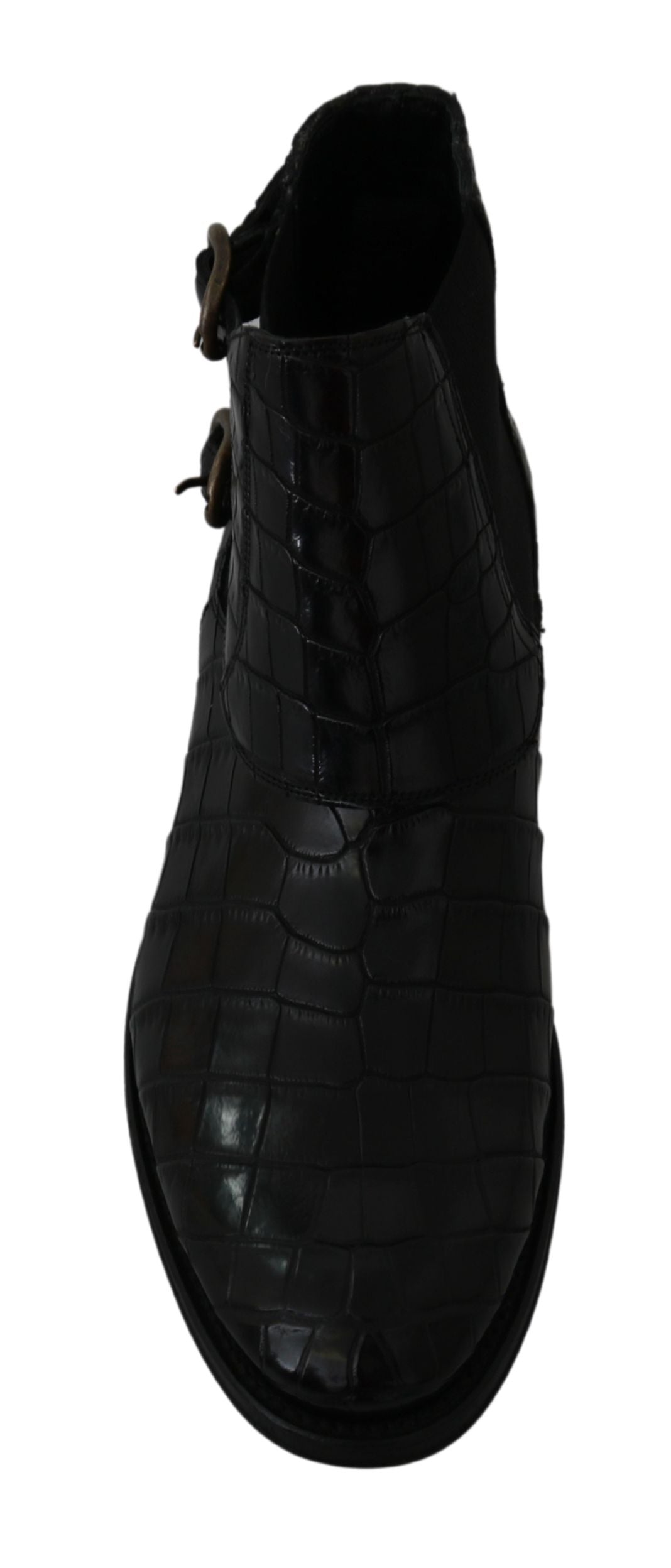 Black crocodile leather derby boots by Dolce & Gabbana featuring sleek design and polished finish.