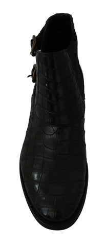 Black crocodile leather derby boots by Dolce & Gabbana featuring sleek design and polished finish.
