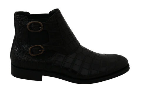 Black crocodile leather Derby boots by Dolce & Gabbana with sleek design and polished finish, showcased on a neutral background.