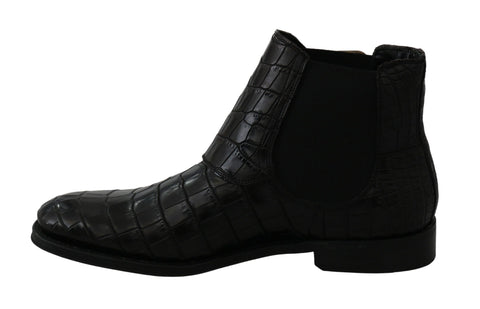 Black crocodile leather derby boots by Dolce & Gabbana, showcasing polished leather and classic lace-up design.