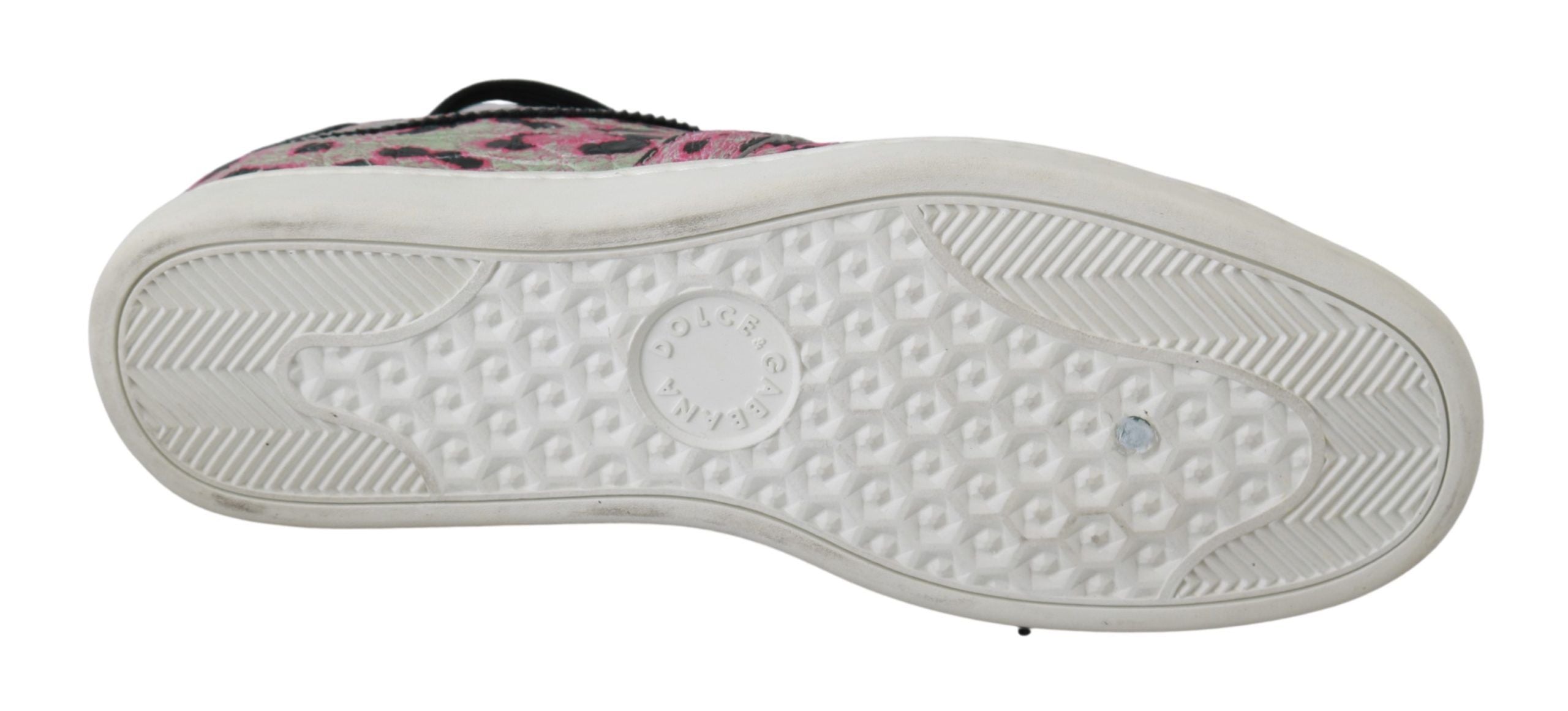 Pink leopard print leather flat sneakers by Dolce & Gabbana with lace-up design and casual style.