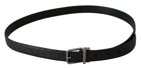 Black exotic skin pattern belt with silver buckle from Dolce & Gabbana, featuring textured leather and stylish design.