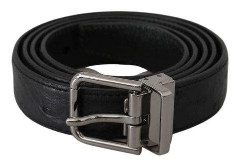 Black exotic skin pattern leather belt with silver buckle from Dolce & Gabbana, featuring textured animal print design.