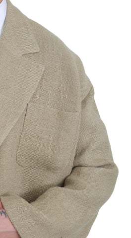 Beige Dolce & Gabbana jute blazer coat with tailored fit, collar, and long sleeves, styled as a sophisticated jacket or coat.