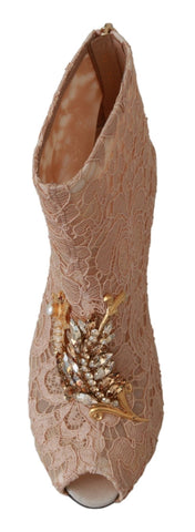 Pink crystal lace Dolce & Gabbana stiletto booties with intricate lace and sparkling embellishments, stylish footwear for elegant occasions.