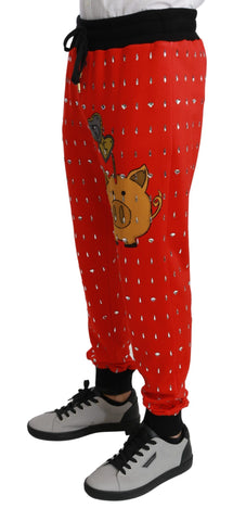 Red piggy bank cotton trousers by Dolce & Gabbana featuring crystal embellishments and a tailored fit.