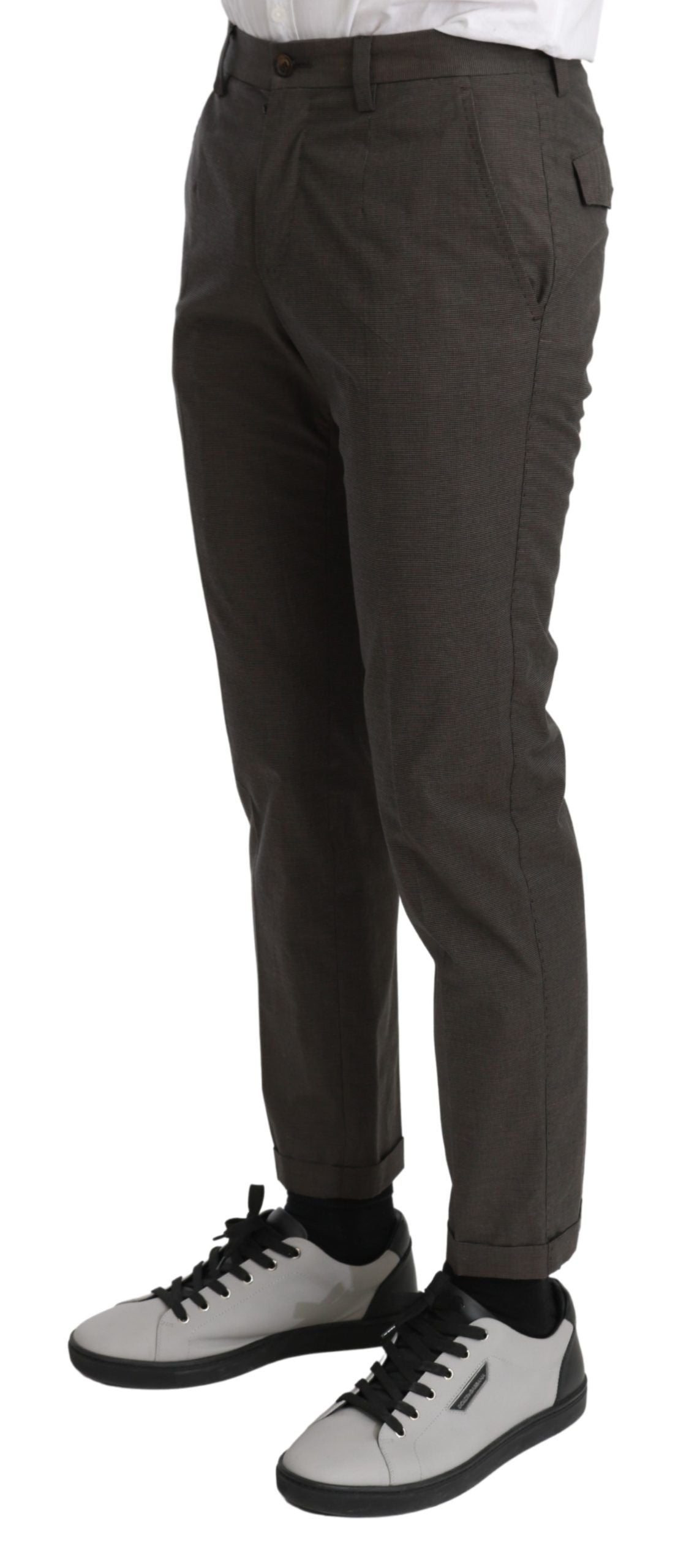 Brown casual men's trousers by Dolce & Gabbana made of 100% cotton, shown laid flat with a focus on the fabric and fit.