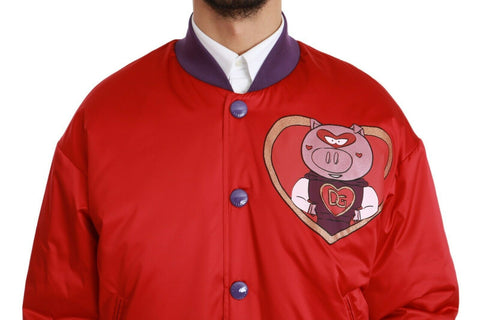 Red Dolce & Gabbana Year of the Pig bomber jacket with embroidered pig design and ribbed cuffs, front zipper closure.