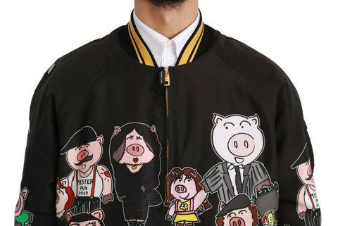 Black Dolce & Gabbana Year of the Pig bomber jacket with embroidered pig design and ribbed cuffs, front zipper closure.