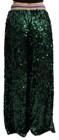 Green sequin trousers with a high waist and wide-leg fit from Dolce & Gabbana Queens Angel Pants collection.