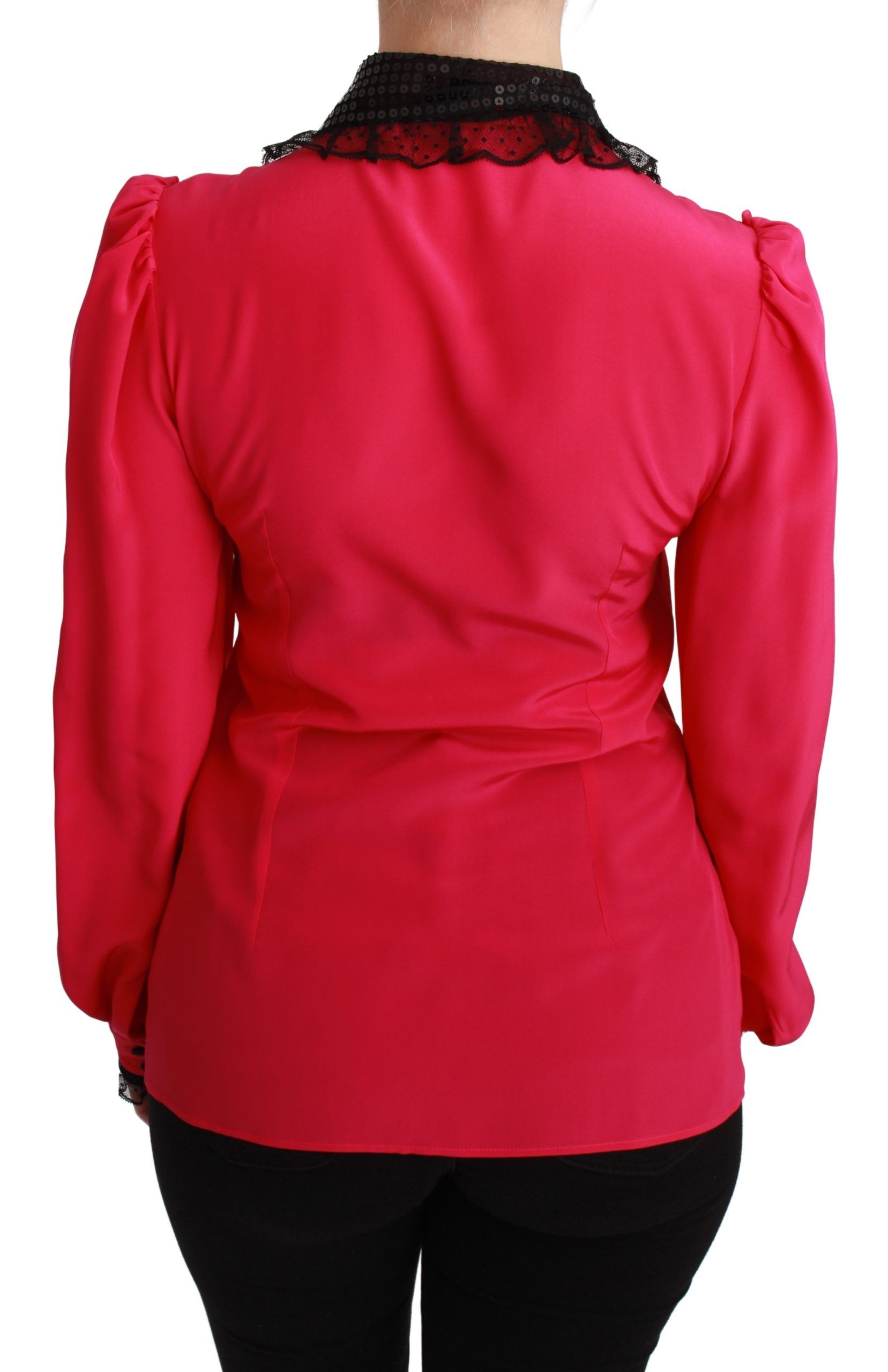 Pink silk blouse with black sequined lace detailing, stylish shirt by Dolce & Gabbana, showcased on a hanger.