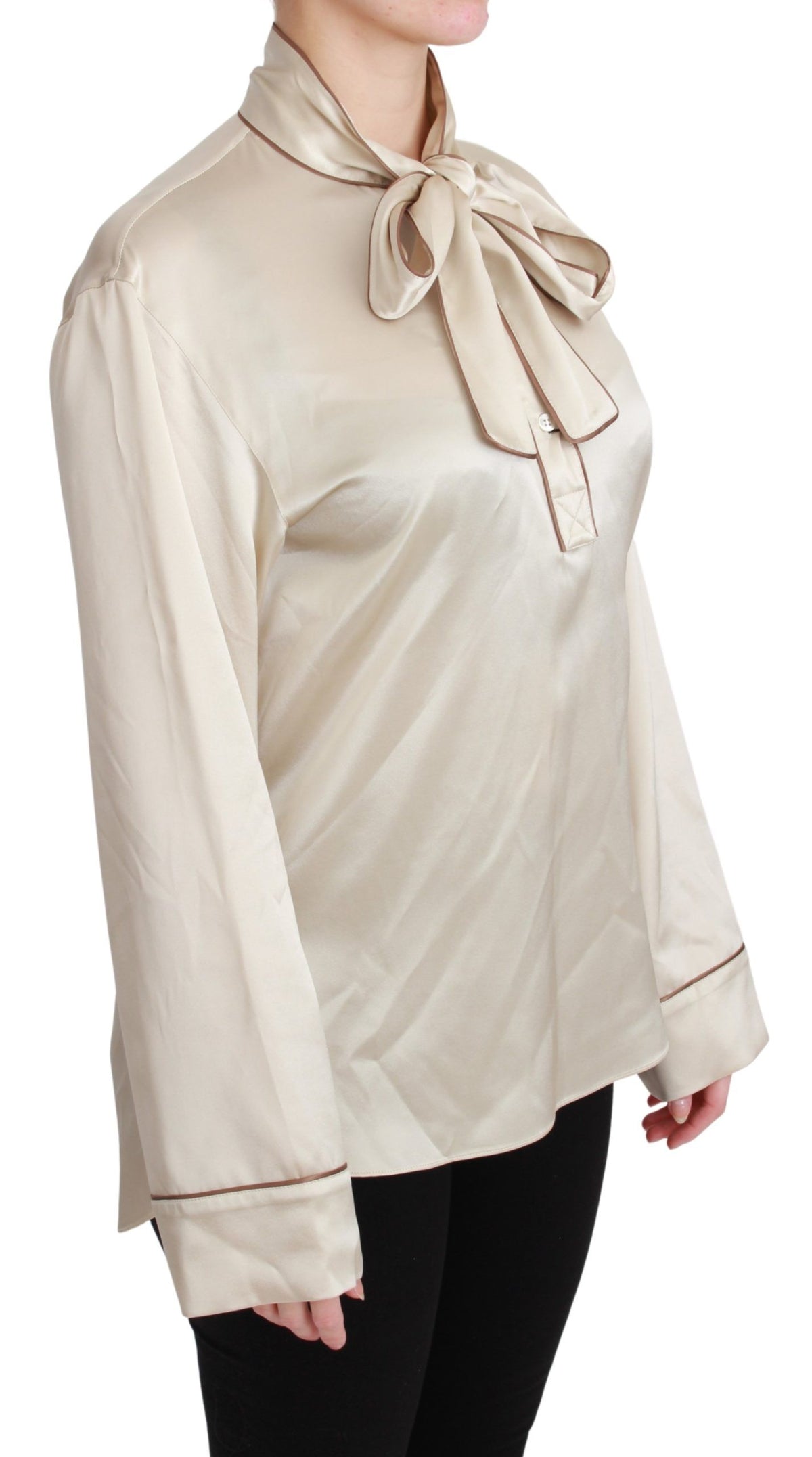 Beige satin sleeve top by Dolce & Gabbana, silk blouse with long sleeves and elegant fit, visible close-up of fabric and design details.