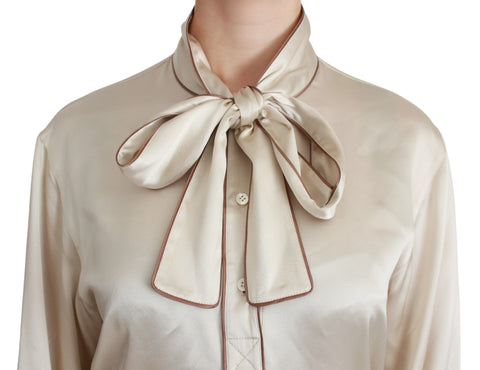 Beige silk satin blouse with long sleeves from Dolce & Gabbana Queen Sleeve Top collection, elegant and stylish women's shirt.