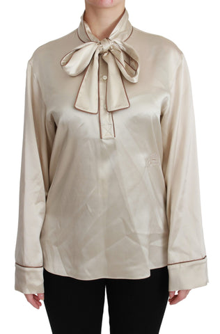 Beige silk satin blouse with long sleeves from Dolce & Gabbana Queen collection, stylish and elegant top for women.