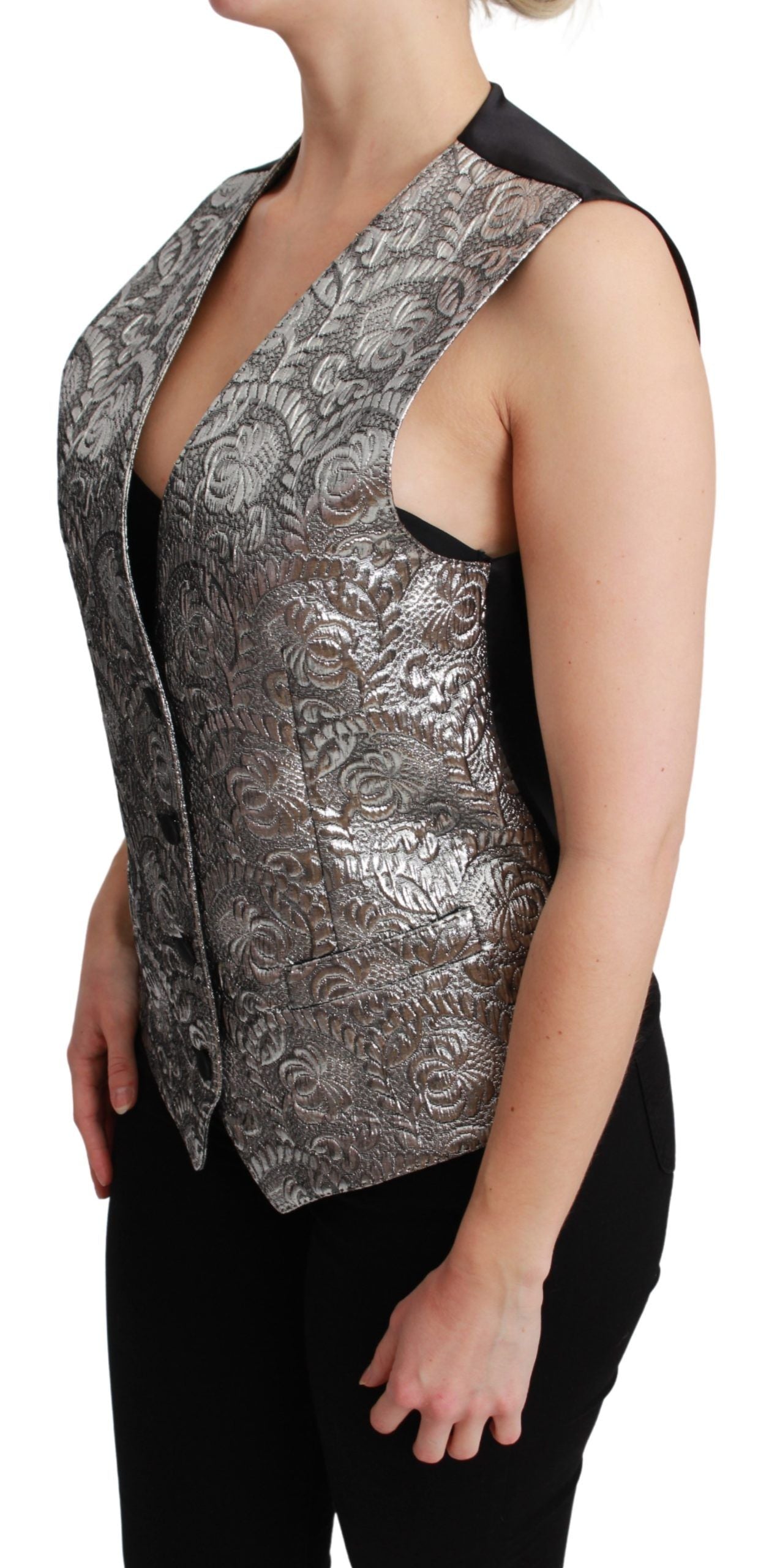 Silver brocade sleeveless metallic top by Dolce & Gabbana, featuring intricate fabric details and a sleek, fitted design.