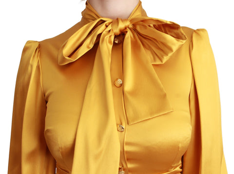Yellow silk stretch sheath bodycon mini dress by Dolce & Gabbana, fitted design with sleek silhouette and elegant fabric.