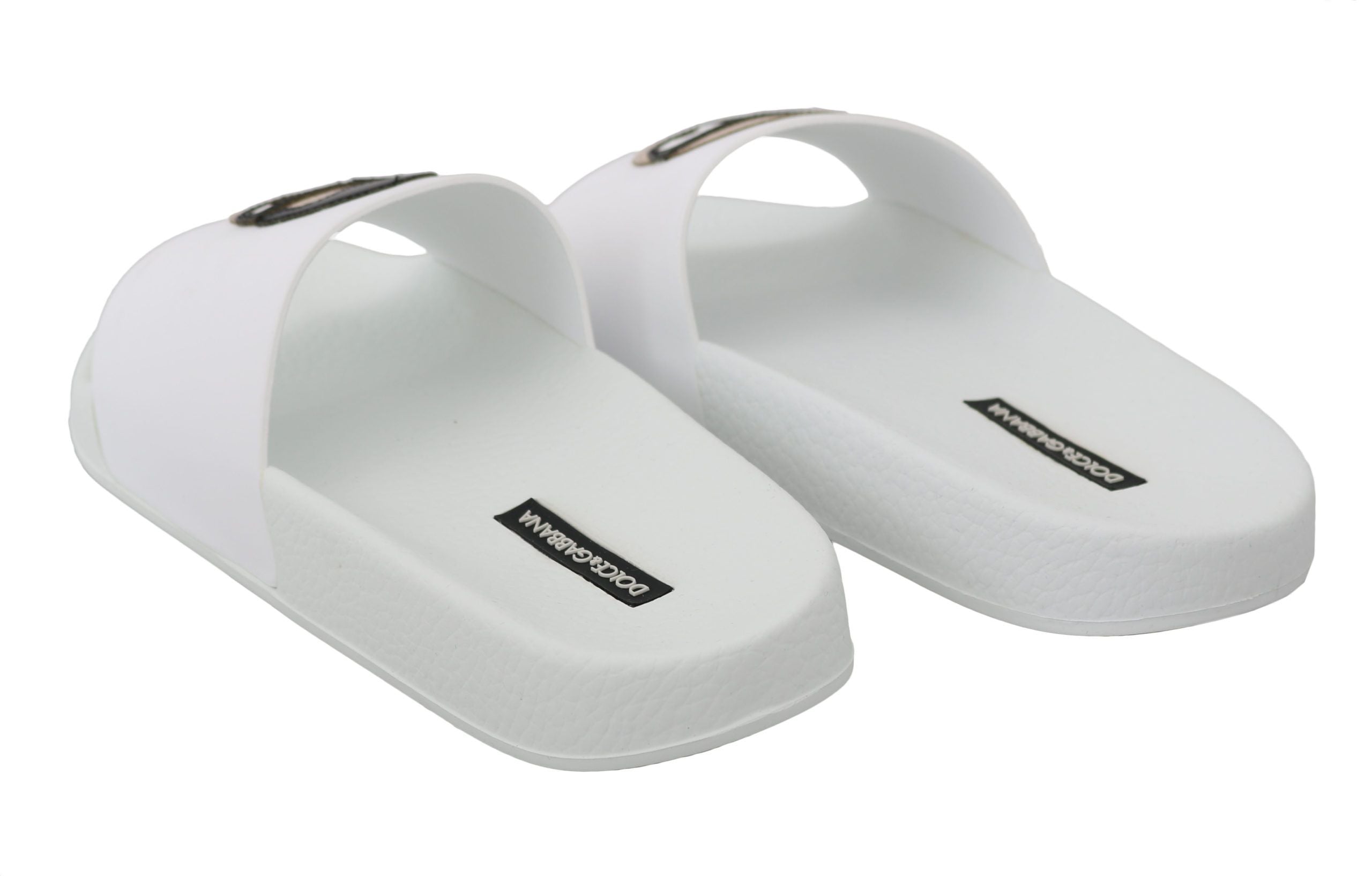 White leather Dolce & Gabbana #dgfamily slides sandals with open toes and wide straps, showcasing stylish casual footwear.