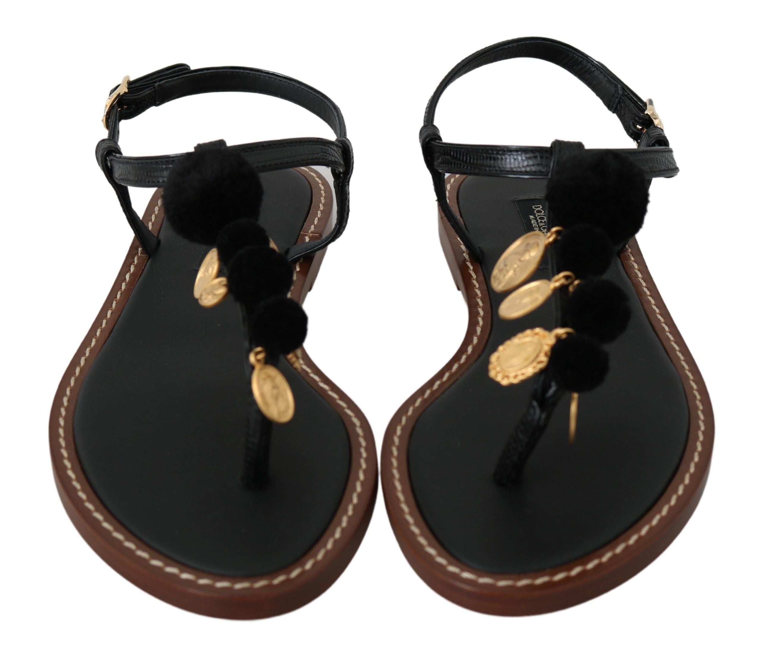 Black leather Dolce & Gabbana coins flip flops with thong straps and flat soles, stylish summer sandals for casual wear.