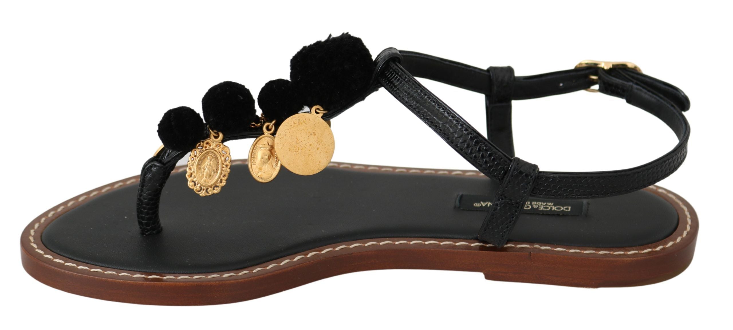 Black leather Dolce & Gabbana coins flip flops sandals with leather straps and branded embellishments, casual summer footwear.