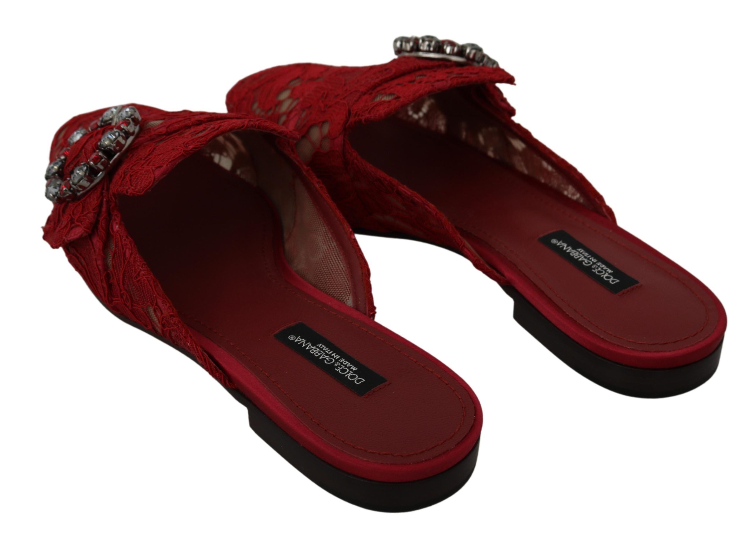 Red lace crystal slide-on flats shoes by Dolce & Gabbana with delicate lace details and sparkling crystal embellishments.