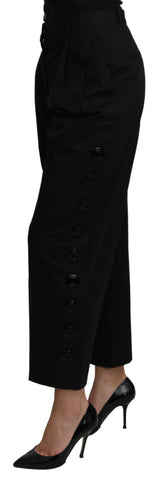 Black high waist cropped cotton stretch pants by Dolce & Gabbana, shown on a model, with a focus on fit and fabric texture.